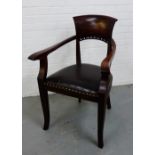 A mahogany framed open armchair, the curved top rail with pierced dot decoration over a leather