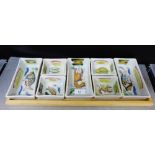 A vintage Buchan pottery hors d'oeurre set on wooden tray comprising seven rectangular and square