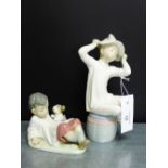 Two Lladro porcelain figures to include a boy with his puppy and another, tallest, (22cm),(2)