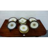 An Aynsley porcelain dessert service with blue and gilded rims comprising twelve plates, two