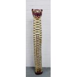 A tall floor standing painted wood model of a cat, 152cm high