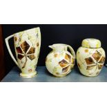 A collection of three Kensington Price 'Gothic' patterned lustre wares to include an Art Deco jug