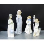 A collection of four Nao porcelain figures, tallest 28cm, (4)