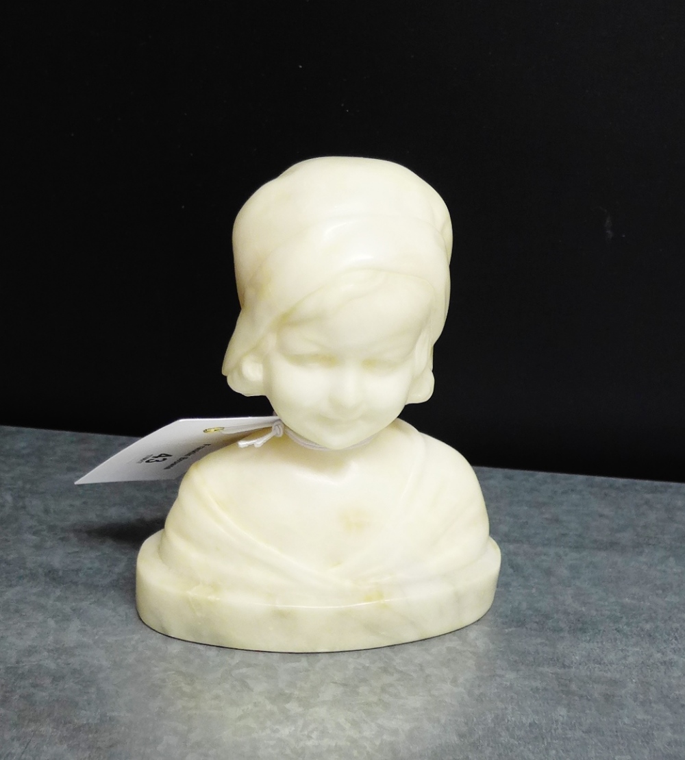 A Goldscheider white alabaster head and shoulders bust of a young girl, sculpted by Otto Petri, 14cm