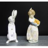 A Lladro porcelain figure of a girl with a basket of oranges and a Nao porcelain figure of a hare,