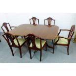 A reproduction mahogany dining table and set of six shield back chairs, (7)