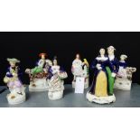 A collection of six small Staffordshire figures, all painted in coloured enamels to include a male