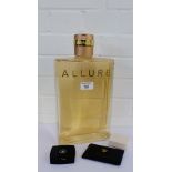 A Chanel Allure factice display perfume bottle containing coloured liquid, 33cm high, together