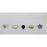 A collection of five 9 carat gold gemset dress rings to include a four stone diamond ring with