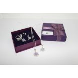 A collection of silver and tanzanite set jewellery to include two pairs of stud earrings, a dress