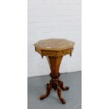 A burrwood work / sewing table, the octagonal top with a fret work frieze and urn finial drops,