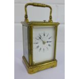 A French brass cased carriage clock, the enamel dial inscribed R. Leitzman, Paris and Cardiff,