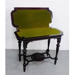 An Aesthetic style ebonised card table, with green felt interior, on turned and reeded supports