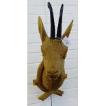 A carved wood Roe Deer's head on a shield back, 65cm long