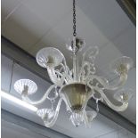 A contemporary six branch glass chandelier, drop 74cm approx