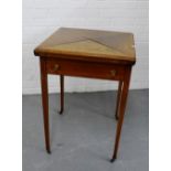 A mahogany envelope card table on square tapering supports 76 x 56cm