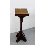 A pine lectern on gothic supports, 140cm