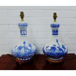A pair of contemporary Chinese style blue and white baluster table lamp bases on turned wood stand,