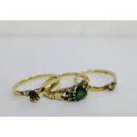 A trio of 9 carat gold cluster forming emerald and CZ dress rings, (3) UK ring size T