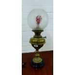 A brass oil lamp base, converted to electricity, complete with etched glass shade, height overall