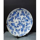 A Chinese blue and white bowl painted with flowers and insects, 28cm diameter, an old plate hanger