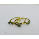 A trio of 9 carat gold cluster forming diamond and aquamarine dress rings, (3) UK ring size T