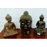 A bronzed lustre glazed Buddha head and two seated Buddha figures, (3)