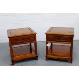 A pair of contemporary rosewood side tables, the square molded tops over a single frieze drawer with