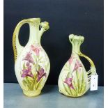 Two Austrian Art Nouveau blush ivory jugs with gilt edged loop handles to side, and painted with