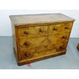 A burr walnut chest, the rectangular top over two short and two long drawers, on a plinth base, 80 x