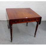 A mahogany drop leaf table, with two short drawers, raised on turned supports and brass castors, 134