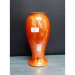 A Ruskin orange lustre glazed baluster vase with impressed back stamps, 27cm