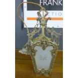 An opaque glass and brass hanging lantern light fitting, approx 36cm long