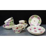 A collection of 19th century English cups and saucers together with a Chinese Canton enamel cup