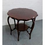 An Edwardian mahogany occasional table, the circular top on cabriole support and with a shelved