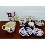 A collection of 19th century Gaudy Welsh lustre wares to include jugs and saucers, together with