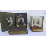 Four Victorian and later leather bound photograph albums containing a selection of portrait