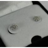 A pair of 9 carat gold and diamond stud earrings, unboxed