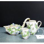 Meissen floral encrusted porcelains to include a small teapot with gilt edged scroll handle to side,