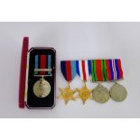 A group of WWII medals and ribbons to include War Medal 1939 - 1945, Defence Medal, France & Germany