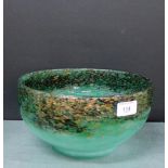 A Moncrieff green Art glass bowl with black mottled ground and aventurine inclusions, 26cm diameter