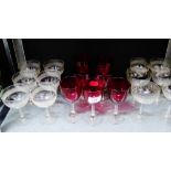 Glass ware to include seven cranberry glass coloured wine glasses and various champagne coupes, (19)