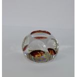 An amber flashed glass paperweight with an etched deer pattern, likely French or Bohemian circa