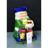 A Copeland Spode Toby jug depicting a seated tavern drinker in green frock coat, blue tricorn hat