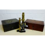 A brass microscope in a mahogany fitted box, together with a leather box containing miscellaneous