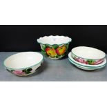 Wemyss Ware to include a pair of rose patterned soup dish and drainer's, together with a frilled rim