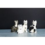 A collection of three Griselda Hill pottery miniature Wemyss cat's together with a Burnham pottery