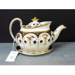 A late 18th/early 19th century Newhall blue and gilt teapot, complete with oval stand