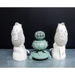 A pair of Japanese white glazed reticulated fish vases together with a celadon glazed pot pourri