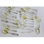 A quantity of Victorian and later silver teaspoons, forks and tongs, etc with various makers and